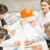 Four Engineers Making Drawings Stock Photo