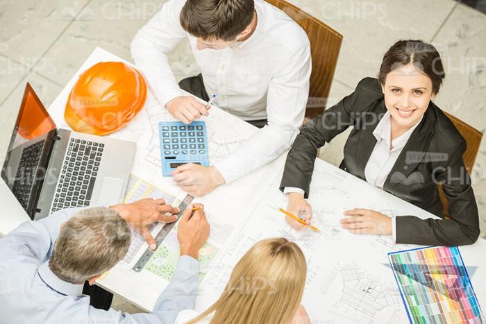 Several Engineers Making Drawing Stock Photo