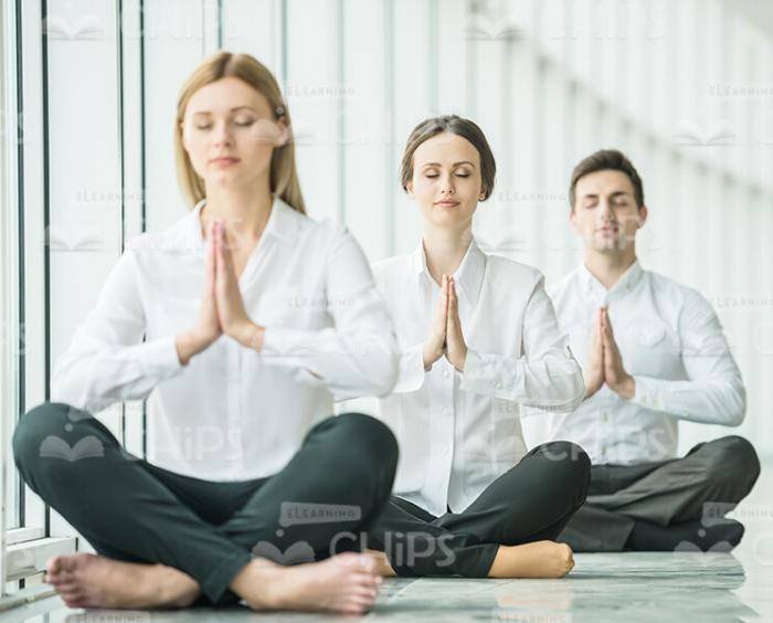 Young Business People Meditating Stock Photo