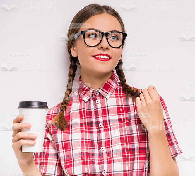 Young Girl Wearing Glasses And Holding Coffee Cup Stock Photo