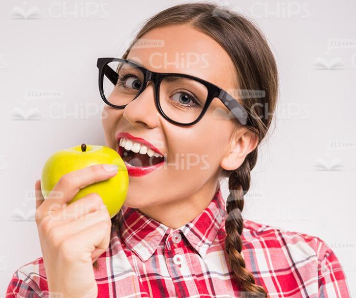 Young Woman Going To Eat An Apple Stock Photo