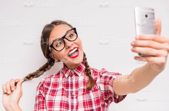 Pretty Female Teenager Taking Selfie Stock Photo