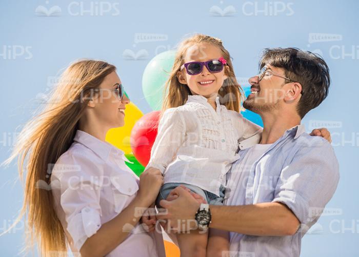 Young Parents And Their Daughter Stock Photo