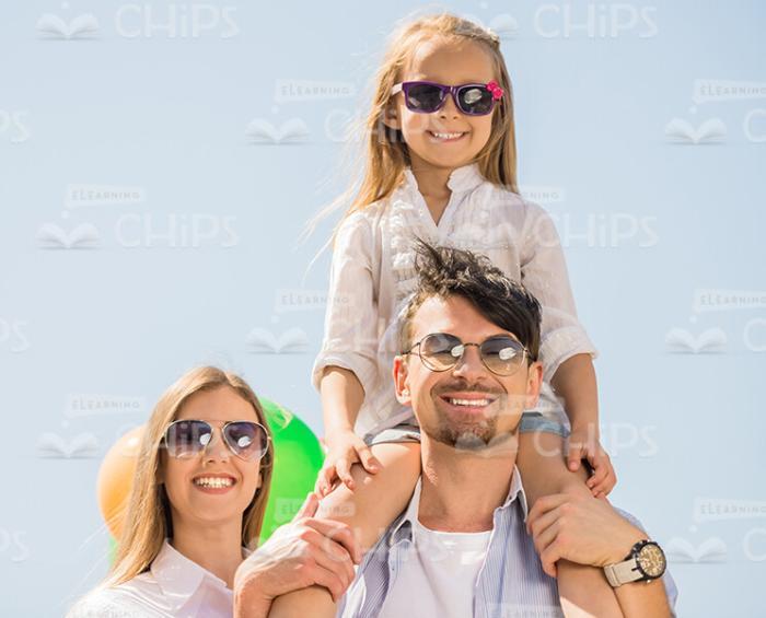 Happy Young Family Wearing Sunglasses Stock Photo