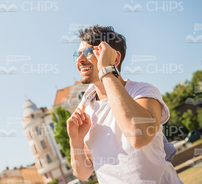 Half-Turned Happy Young Man Looking On Blue Sky Stock Photo Half-Turned Happy Young Man Looking On Blue Sky Stock Photo