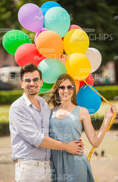 Happy Couple With Balloons Stock Photo