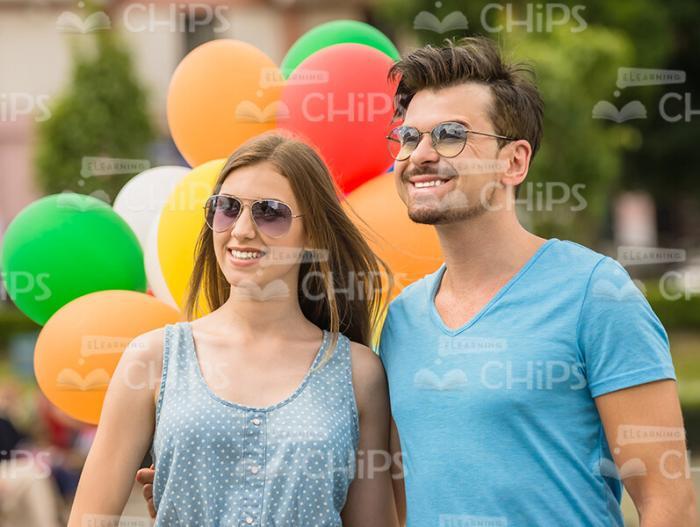 Nice Couple With Colorful Balloons Stock Photo