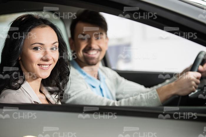 Young Couple Sitting In New Car Stock Photo