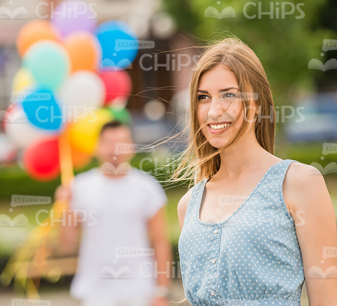 Happy Young Woman Smiling And Looking Into Distance Stock Photo