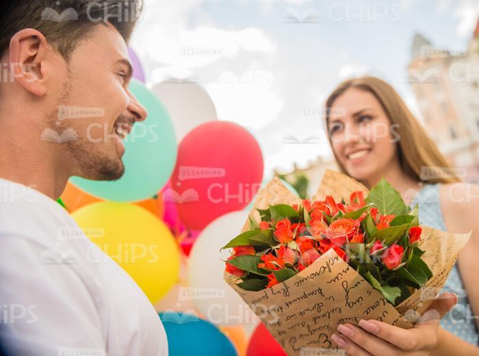 Man Giving Bouquet To Woman Stock Photo