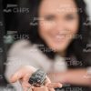 Stock Photo Of Young Woman Holding Keys With Outstretched Hand