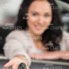 Young Woman Gives Keys With Her Outstretched Hand Stock Photo