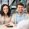 Insurance Agent Talks with Clients Stock Photo