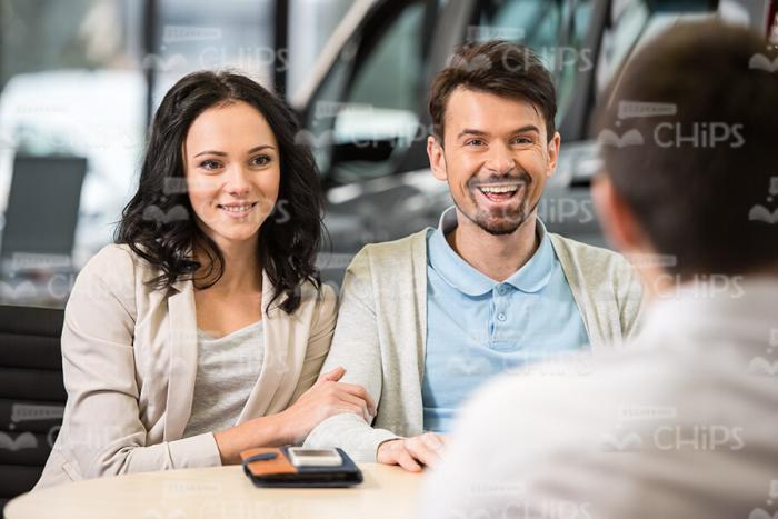 Insurance Agent Talks with Clients Stock Photo