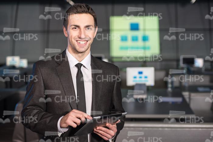 Young Mentor Smiling On Camera Stock Photo