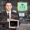 Young Businessman Holding Tablet And Making Presentation Stock Photo