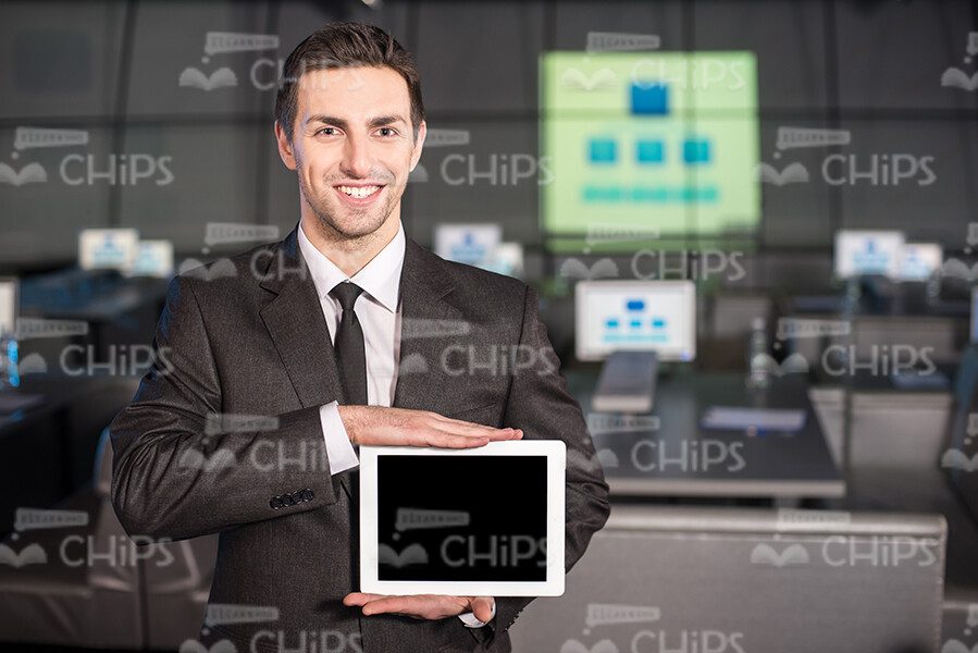 Young Businessman Holding Tablet And Making Presentation Stock Photo Young Businessman Holding Tablet And Making Presentation Stock Photo