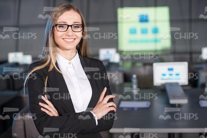 Nice And Confident Businesswoman Crossed Her Arms Stock Photo