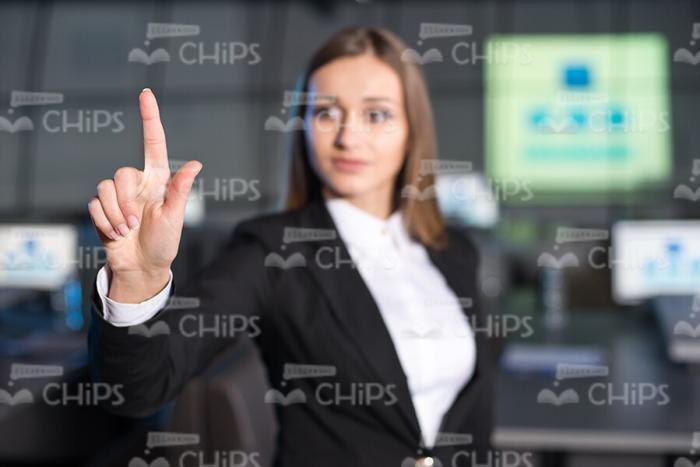 Businesslady Pointing With Finger Stock Photo