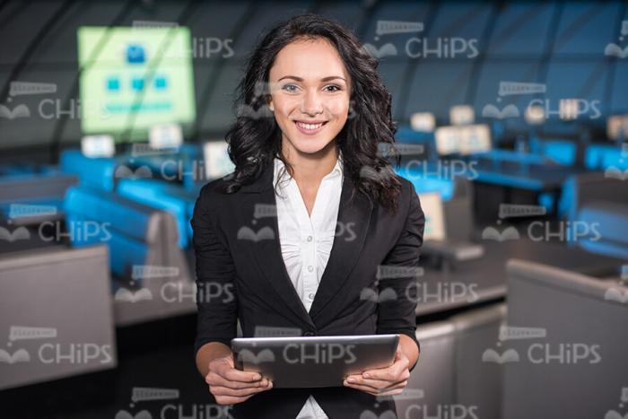 Handsome Businesswoman Holding Tablet Stock Photo