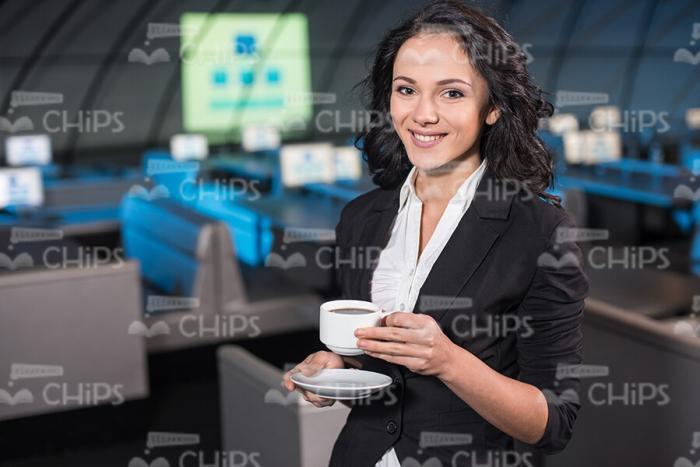 Happy Young Woman In Formal Suit Drinking Coffee Stock Photo