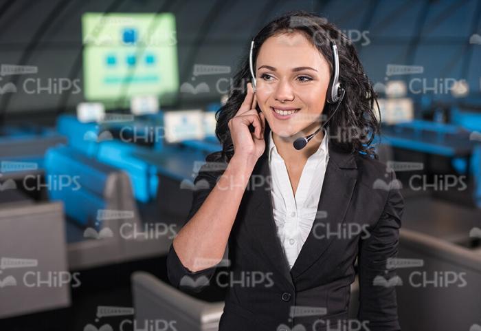 Happy Businesswoman Talking On Phone While Using Headset Stock Photo