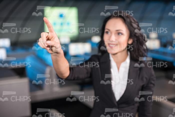 Businesslady Pointing Forward With Her Finger Stock Photo