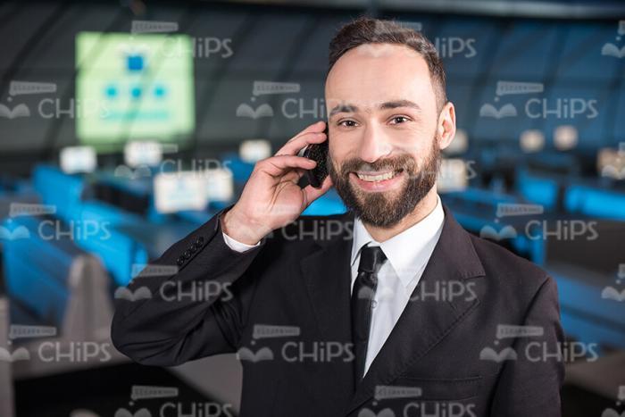 Happy Businessman Talking On Mobile Phone Stock Photo