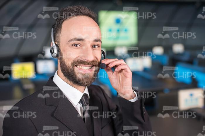 Smiling Business Man Using Headset Stock Photo