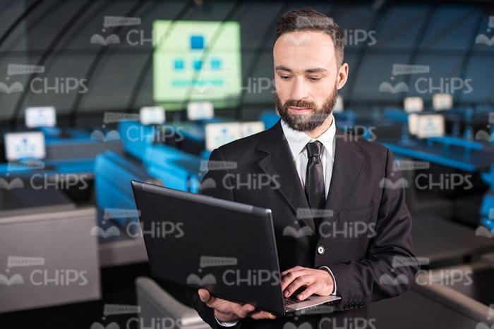 Focused Businessman Using Laptop Stock Photo