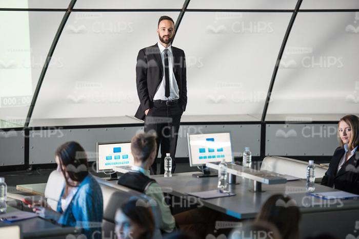 Bearded Business Coach Holding Hands In Pockets Stock Photo