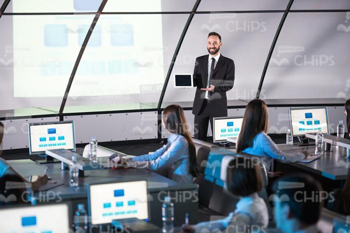 Young Businessman Holds Presentation Stock Photo