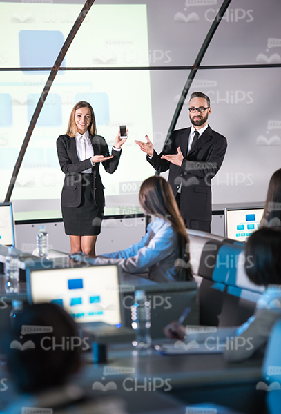 Business People Presenting New Device Stock Photo