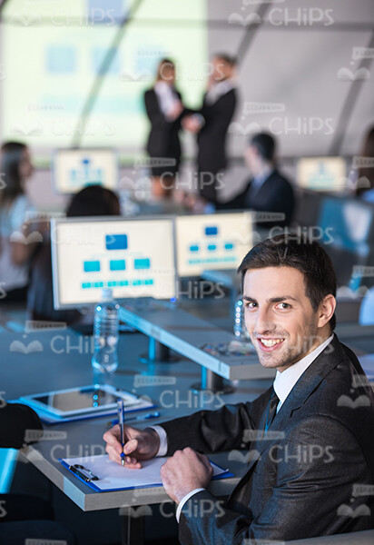 Business Man Filling In Papers Stock Photo
