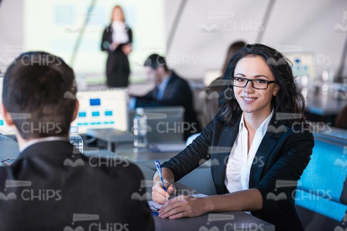 Cheerful Curly Lady At Conference Hall Stock Photo