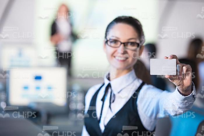 Pretty Lady Holding Business Card Sample Stock Photo
