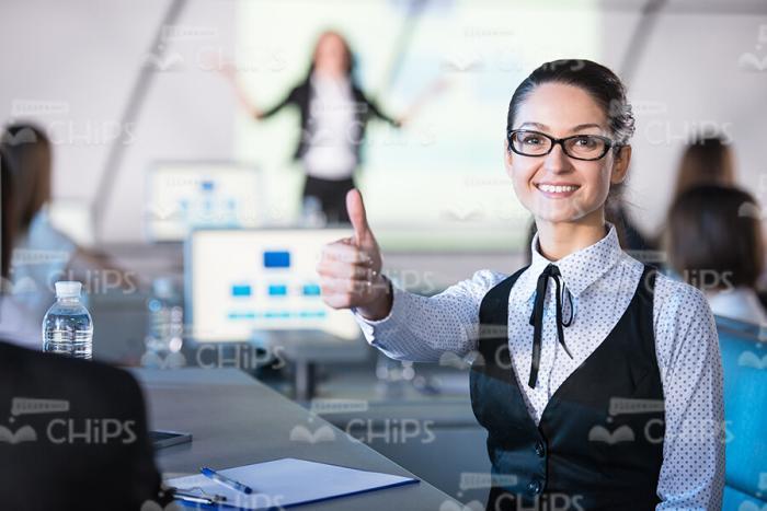 Young Businesswoman Shows Thumb Up Gesture Stock Photo