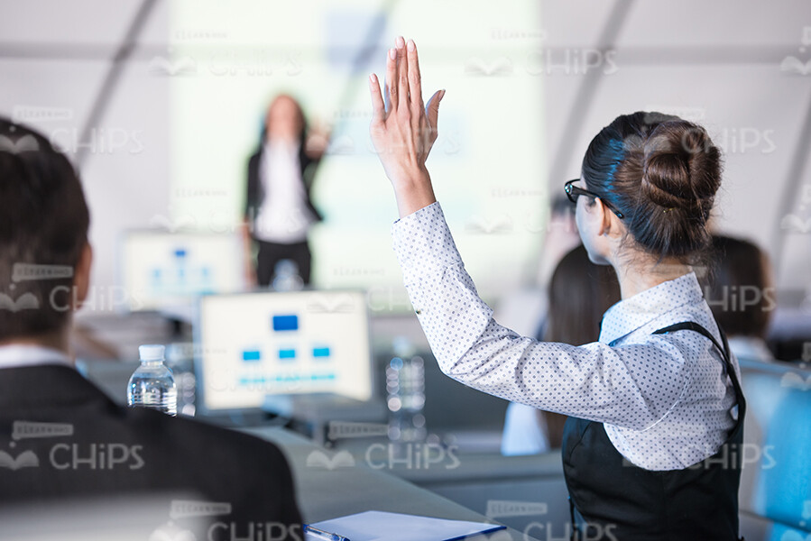 Young Woman Raising Hand Up While Wanting To Say Something Stock Photo Young Woman Raising Hand Up While Wanting To Say Something Stock Photo
