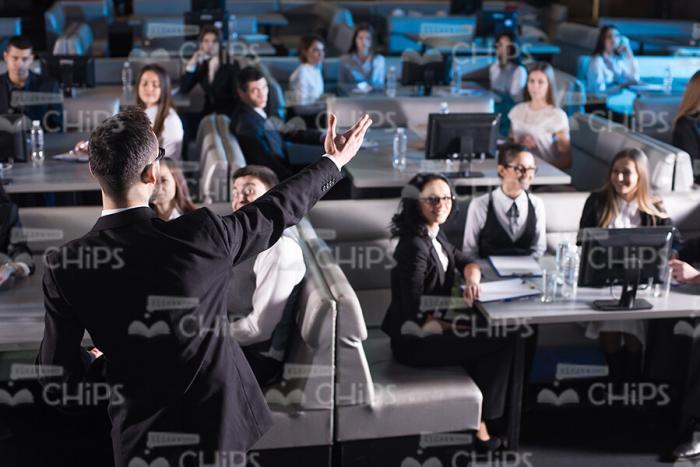 Young Narrator Talking To Audience Back View Stock Photo