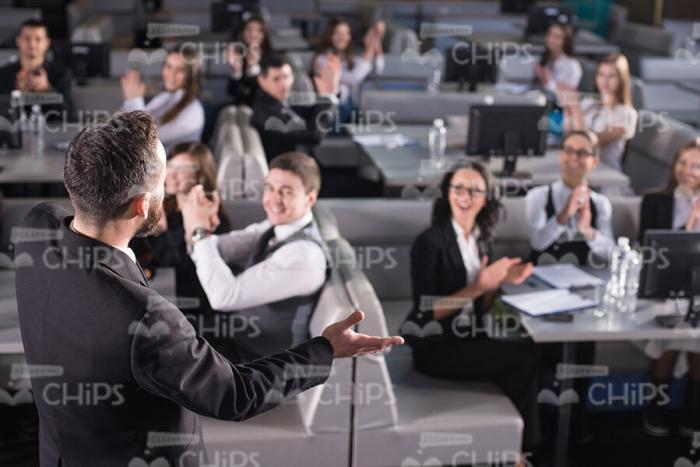 Business Coach Saying Goodbye To Audience Stock Photo
