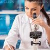 Female Researcher Working With Microscope Stock Photo