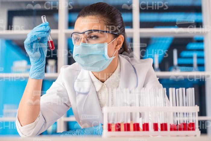 Female Scientist Conducts Researches Stock Photo