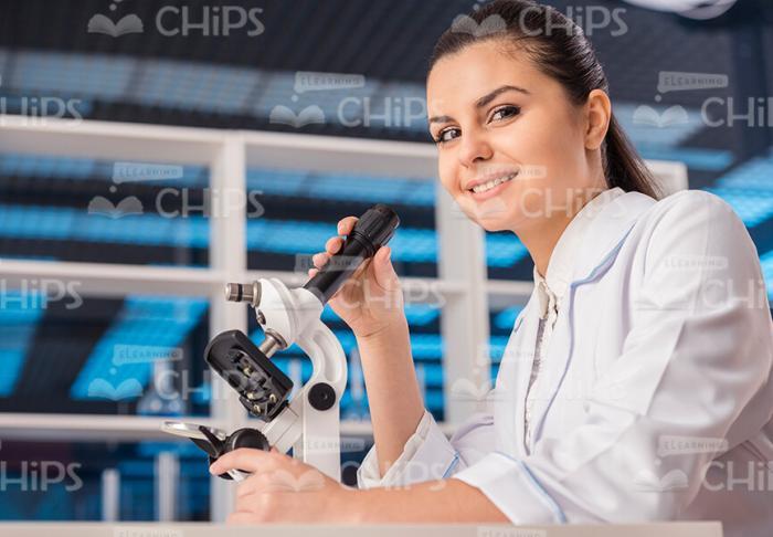 Female Scientist Using Microscope Stock Photo