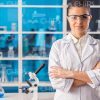 Young Female Researcher Crosses Arms Stock Photo