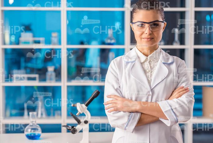 Young Female Researcher Crosses Arms Stock Photo