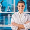 Woman Scientist At Lab Standing With Her Arms Crossed Stock Photo