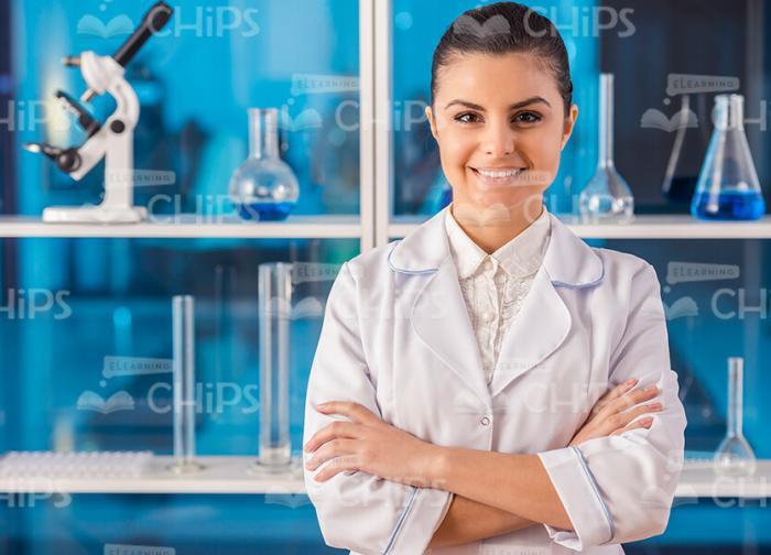 Woman Scientist At Lab Standing With Her Arms Crossed Stock Photo
