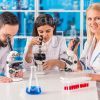 Young Female Scientist Working With Colleagues Stock Photo