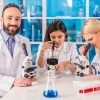 Bearded Chemist With His Colleagues Stock Photo