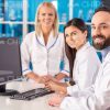 Scientists Working With Computer At Laboratory Stock Photo